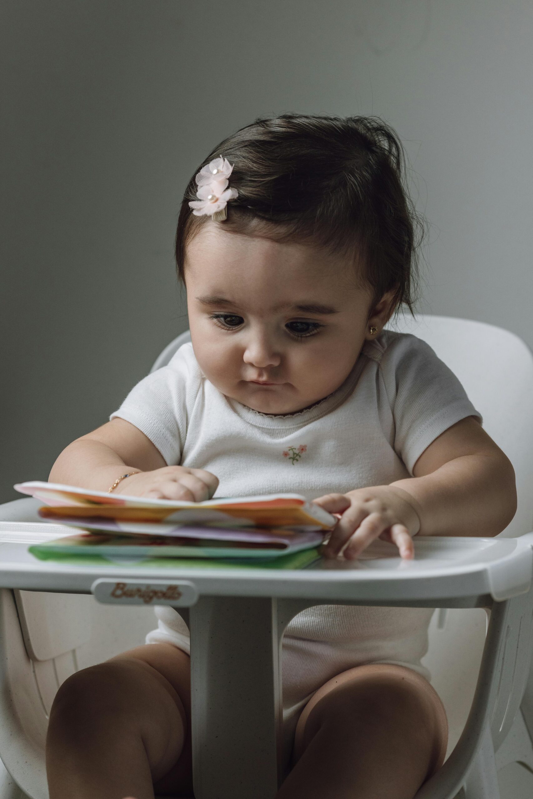 Baby Girl Sitting at Table