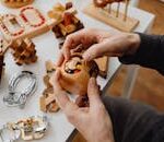 Person Holding a Wooden Toy